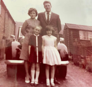 John Podmore - Marie's mum's brother - with his wife Stella, and their daughter Jayne, on a visit to Single Row, with Marie in the pale dress front right, around the mid-1960s.