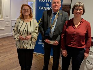 Vicki from Cannock foodbank receiving a cheque from SI Cannock Tracey Stokes and Rotary President David Marklew