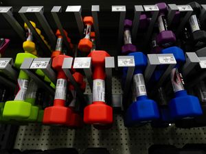 Dumbbells are displayed at a Walmart store