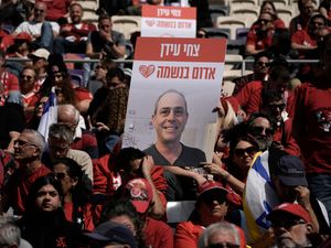 People attend a public memorial ceremony for slain hostage Tsachi Idan