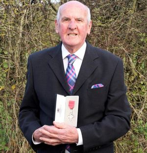 Bill proudly showing his MBE
