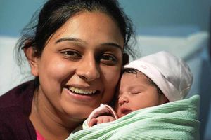 With her as yet unamed baby girl, born on Christmas Day, is mother Poonam Deol, of West Bromwich, at Walsall Manor Hospital