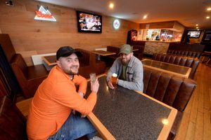 Nick Hughes and Adam Williams enjoy a drink at Jubilee House