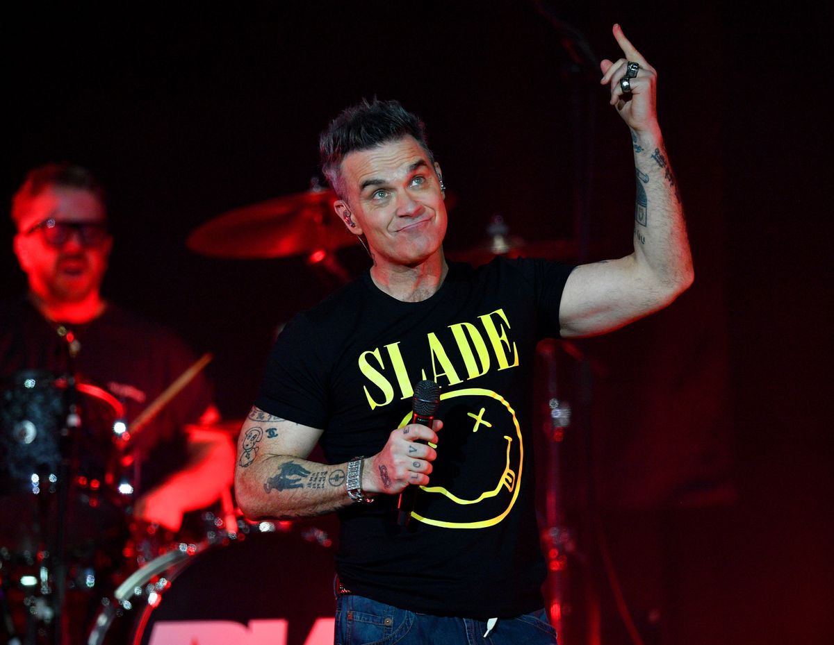 Nostalgic hits and new crowd-pleasers with familiar cheeky banter: Our review of Robbie Williams at The Halls Wolverhampton