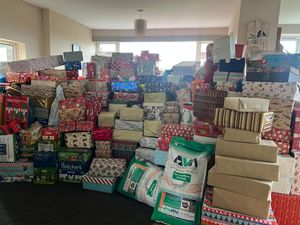 An astonishing amount of presents piled high at Cheryl's home.