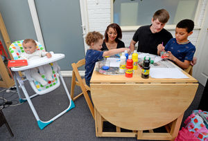 Dane Miller and Jay Walker from Oldbury, with their children Luca, 10, Leo, four, and baby Levi