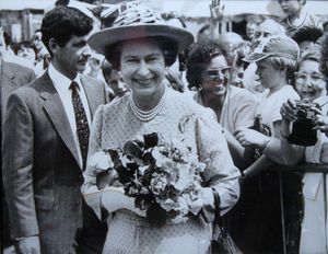 Hilda Tonks, of Bloxwich, pictured behind the Queen's left shoulder during her visit to Redditch in 1982
