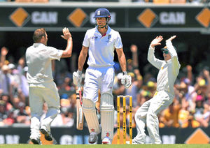 Australia's Ryan Harris (left) celebrates taking the wicket of England's Alastair Cook (centre) during day two