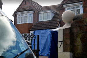A police sheet covering the entrance to the house in Rookery Lane after Sarbjit Kaur's murder