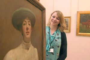 Jenny Bell admires a portrait in the gallery