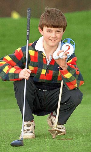 Ashley Chesters as a a nine-year-old celebrating two hole in ones.
