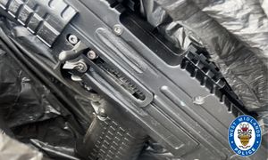 A photo of a firearm believed to be advertised for sale was found in Woodcock's phone.