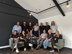 The team at national office, located in Shrewsbury, celebrate their win.