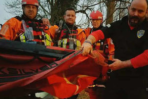 Members of the West Midlands Search & Rescue Team with the damaged boat. Photo: WMSAR