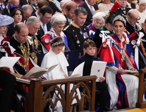 He was sat next to his sister, Princess Charlotte