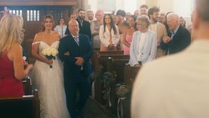 Tori walks down the aisle at Studley Parish Church.