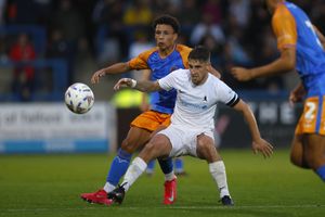Will Gray of Shrewsbury Town competes with Luke Rowe of AFC Telford United