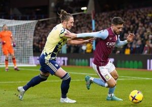 Leeds United's Luke Ayling pulls back on Aston Villa's Alex Moreno