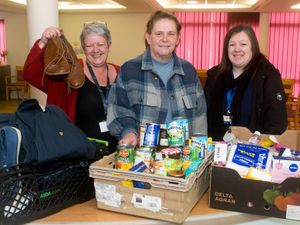 L Gayna Miles (GSA) presents Lisa and Jess from (Hope Community Project) with the latest donations from Showell Court.