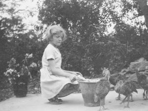 Supporting image for story: Who is she? Mystery surrounds photo of girl feeding turkeys in 1940s Much Wenlock