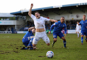 Chris Churchman of Stockport County fouls Andy Owens of AFC Telford United