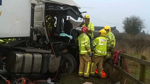 Firefighters with the lorry. Photo: West Midlands Ambulance Service.