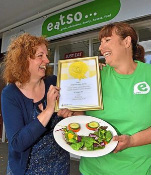 Councillor Julie Fitzpatrick hands over the award to Eatso owner Sara Birch
