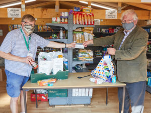 Supporting image for story: Rotarians give food bank a cash boost