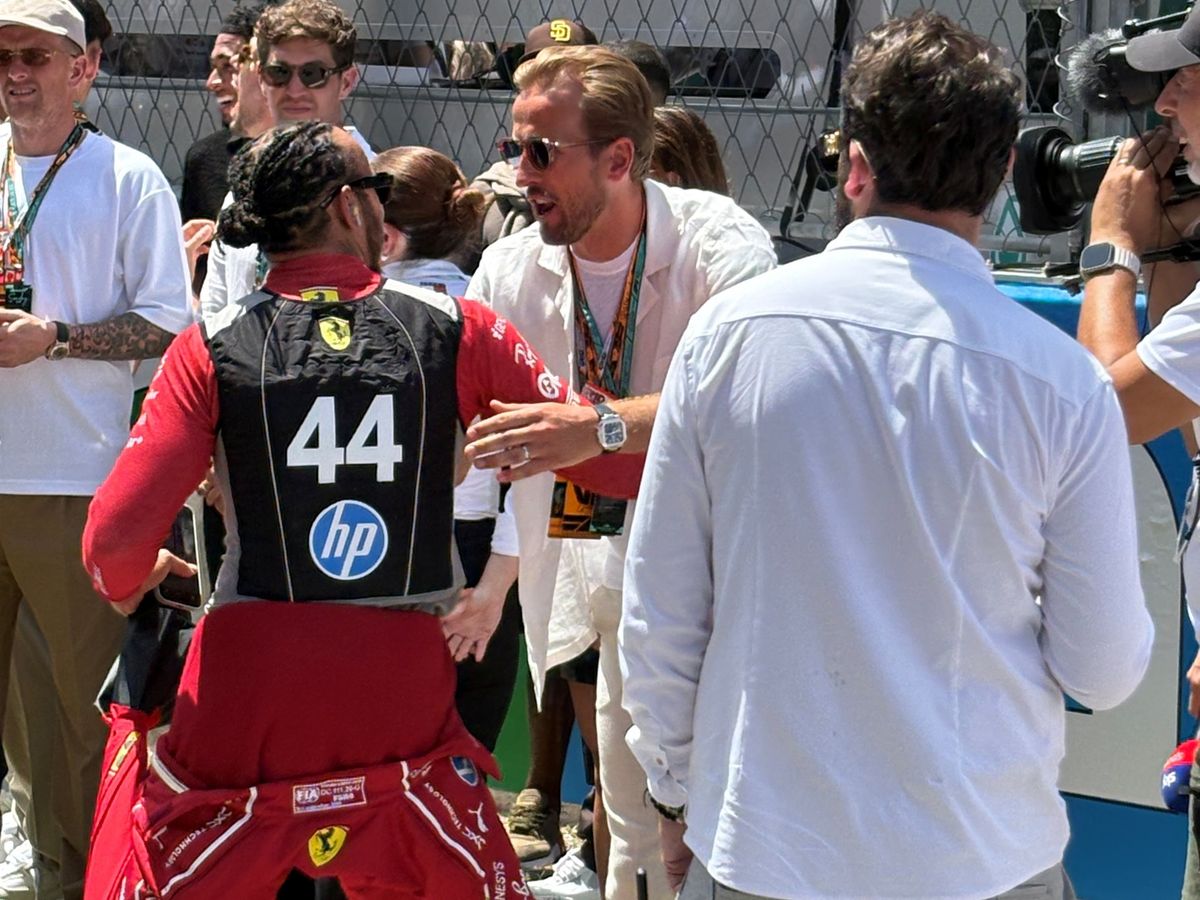 Harry Kane greets Lewis Hamilton as England players take in Spanish Grand Prix