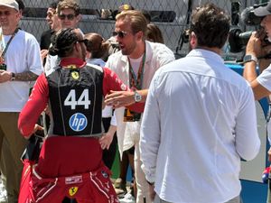 Supporting image for story: Harry Kane greets Lewis Hamilton as England players take in Spanish Grand Prix