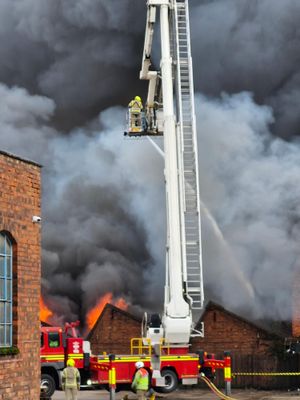 Crews are battling the blaze at a unit at the junction of Sunbeam Street and Upper Villiers Street