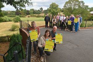 Campaigners launch their petition in front of Corbett Meadow. Front: Stourbridge MP Cat Eccles and action group spokesman Lance Cartwright, local resident Helen Cooke, left, and residents