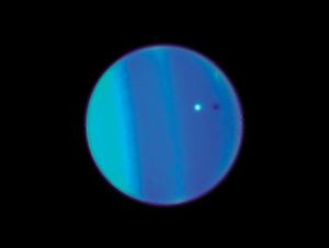 This 2006 image provided by Nasa shows an image of Uranus with its moon Ariel, small white sphere, made by the Hubble Space Telescope