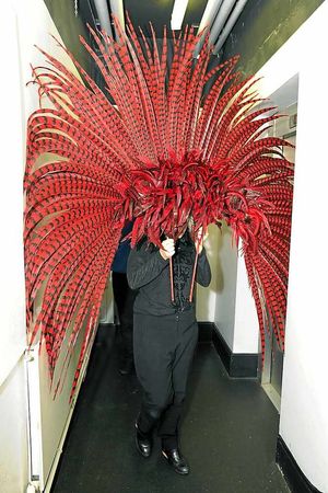 One of Ceri's headdresses is so large it takes two people to move it