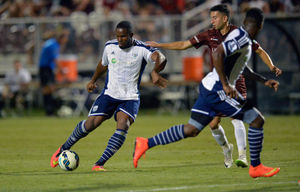 Victor Anichebe of West Bromwich Albion shoots and scores a goal.