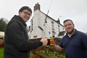 Andy Brough and son Dan enjoy some of the fruits of their labour outside the All Nations Inn