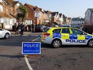 Detectives and police officers at the scene in Paignton 