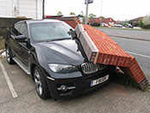 Supporting image for story: Boss's BMW crushed by wall