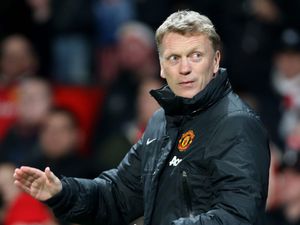 Former Manchester United manager David Moyes looks behind him before a Premier League derby against Manchester United at Old Trafford