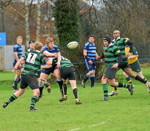 Market Drayton RFC (Green) v Shrewsbury (Blue) at Greenfields, Market Drayton. Shrewsbury's Robert Sankey passes the ball.