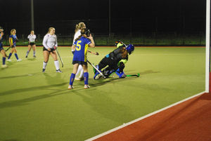 Stourport's keeper dives to save an Ashby shot.