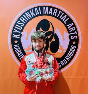 Edward with his combat medals in full contact and grappling categories