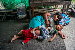 A mother and son sleep