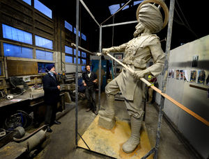 Councillor Bhupinder Singh Gakhal and members of the Guru Nanak Gurdwara in Wednesfield view the monument to the 36th Sikh Regiment being sculpted by Luke Perry
