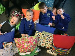 The children enjoying the Reading  Pillows!