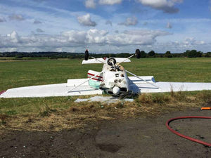 Supporting image for story: Pilot scrambles free as plane ends up on roof at Halfpenny Green airport