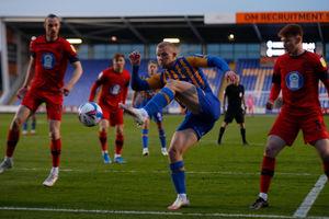Curtis Main of Shrewsbury Town has a shot at goal (AMA)