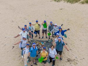 Supporting image for story: Lottery winners join beach clean-up to ‘give something back’