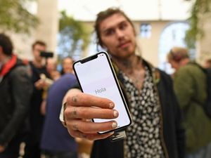 Supporting image for story: Reality TV star joins crowds queuing for new iPhone X