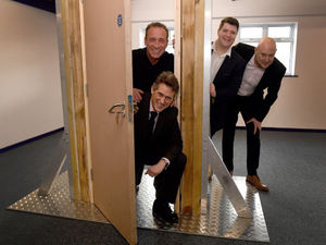 Supporting image for story: Change of career? Sir Gavin proves a dab hand at inspecting fire safety doors